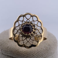 Bague marguerite pierre grenat or jaune 2,37 g